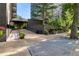 Building entrance with lush landscaping and an American flag at The Park Lane Condominiums at 460 S Marion Pkwy # 453, Denver, CO 80209