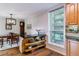 Charming kitchen and dining area with a breakfast bar, wooden floors, and large windows with an outside view at 460 S Marion Pkwy # 453, Denver, CO 80209