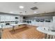 Well-lit laundry room equipped with multiple washers and dryers, ample folding space, and a tidy environment at 460 S Marion Pkwy # 453, Denver, CO 80209