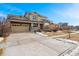 Two-story house with stone and beige siding, attached garage, and landscaping at 258 N Catawba Ct, Aurora, CO 80018