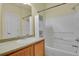 Clean bathroom with tub shower, single sink vanity, and neutral wall paint, providing a relaxing retreat at 3223 Iron Forge Pl # 108, Boulder, CO 80301