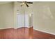 Spacious bedroom with hardwood floors, high ceilings, and a double closet providing ample storage space at 3223 Iron Forge Pl # 108, Boulder, CO 80301