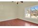 Cozy bedroom with hardwood floors and large window, offering plenty of natural light and space to relax at 3223 Iron Forge Pl # 108, Boulder, CO 80301