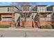 Charming townhome featuring private front porches with wooden accents and low-maintenance landscaping at 3223 Iron Forge Pl # 108, Boulder, CO 80301