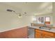 Bright kitchen with hardwood floors, stainless steel dishwasher, and wood cabinets for a functional space at 3223 Iron Forge Pl # 108, Boulder, CO 80301