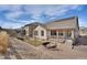 Spacious backyard featuring a fire pit area and meticulous landscaping at 9772 Taylor River Cir, Littleton, CO 80125