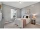 Cozy bedroom with soft carpeting, neutral wall color, and ample natural light at 9772 Taylor River Cir, Littleton, CO 80125