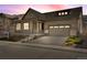 Charming single-Gathering home boasting a welcoming front porch and attached two-car garage at 9772 Taylor River Cir, Littleton, CO 80125