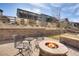 Cozy backyard fire pit area with chairs, ideal for relaxing evenings outdoors at 9772 Taylor River Cir, Littleton, CO 80125