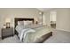 Calm main bedroom suite with a large bed, soft lighting, and an en-suite bathroom at 9772 Taylor River Cir, Littleton, CO 80125
