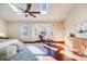 Main bedroom with hardwood floors, bay window, and ceiling fan at 16504 E Dorado Ave, Centennial, CO 80015