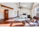 Main bedroom with hardwood floors, large windows, and a ceiling fan at 16504 E Dorado Ave, Centennial, CO 80015