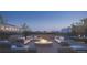 Inviting rooftop terrace with a cozy fire pit, comfortable seating, and stunning city views for entertaining and relaxation at 185 Steele St # 503, Denver, CO 80206