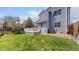 Lush backyard features a well-kept lawn and a cozy deck, perfect for outdoor enjoyment at 2330 Redwood Ave, Lafayette, CO 80026