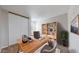 The office with a bookshelf and a desk provides ample space for work or hobbies at 2330 Redwood Ave, Lafayette, CO 80026