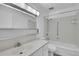 Clean bathroom features a vanity and a bathtub-shower combo at 9655 E Center Ave # 9D, Denver, CO 80247