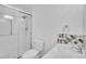 Well-lit bathroom features a tiled shower and modern vanity at 9655 E Center Ave # 9D, Denver, CO 80247