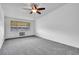 Bright bedroom features a ceiling fan and neutral carpeting at 9655 E Center Ave # 9D, Denver, CO 80247
