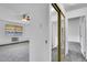 View of bedroom with gray carpet and mirrored closet doors at 9655 E Center Ave # 9D, Denver, CO 80247