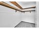 Walk-in closet with carpeted floor and built in shelving at 9655 E Center Ave # 9D, Denver, CO 80247