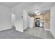 Bright kitchen with stainless steel appliances and lots of counterspace, open to the living area at 9655 E Center Ave # 9D, Denver, CO 80247