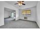 Inviting living area with a sliding glass door and neutral decor at 9655 E Center Ave # 9D, Denver, CO 80247