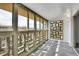 Enclosed sunroom with ample natural light and views of the outdoors at 9655 E Center Ave # 9D, Denver, CO 80247