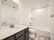 Clean bathroom, featuring a bathtub and vanity with a quartz countertop at 4664 Windmill Dr, Brighton, CO 80601