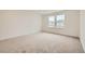 Bright bedroom with neutral carpeting and large windows at 4664 Windmill Dr, Brighton, CO 80601