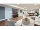 Finished basement with hardwood floors, a pool table, a large tv and furniture at 25097 E Lake Dr, Aurora, CO 80016