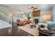 The living room features hardwood floors and a stone fireplace with barn door at 25097 E Lake Dr, Aurora, CO 80016