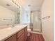 Clean bathroom with a shower/tub combo, vanity, and wood cabinets at 246 Rockview Dr, Superior, CO 80027