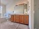 Bathroom features a double vanity and a shower/tub combination at 246 Rockview Dr, Superior, CO 80027