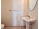 Simple bathroom with pedestal sink, mirror and toilet at 246 Rockview Dr, Superior, CO 80027