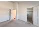 Empty bedroom featuring carpet, walk-in closet and door at 246 Rockview Dr, Superior, CO 80027