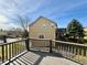 Spacious deck with views of the backyard and blue skies above at 246 Rockview Dr, Superior, CO 80027