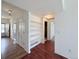 Inviting entryway featuring hardwood floors and built-in shelving at 246 Rockview Dr, Superior, CO 80027