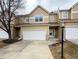 Charming townhome boasts a two-car garage and welcoming front entrance at 246 Rockview Dr, Superior, CO 80027