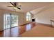 Living room featuring a fireplace, vaulted ceiling, and balcony access at 246 Rockview Dr, Superior, CO 80027