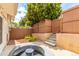 Backyard featuring a privacy fence, patio, and landscaped areas at 1005 S Miller Way, Lakewood, CO 80226