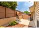 Backyard features a fenced in area, patio, and landscaped beds at 1005 S Miller Way, Lakewood, CO 80226