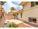 Backyard with patio, privacy fence, landscaping, and house exterior at 1005 S Miller Way, Lakewood, CO 80226