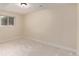 Bright bedroom with neutral carpet and a window providing natural light at 1005 S Miller Way, Lakewood, CO 80226