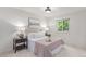 Cozy bedroom with neutral tones, a comfortable bed, and a window view at 1005 S Miller Way, Lakewood, CO 80226