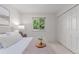 Cozy bedroom with a bed, window and double door closet at 1005 S Miller Way, Lakewood, CO 80226