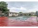 Community tennis court with basketball hoops, adjacent to a clubhouse and townhomes at 1005 S Miller Way, Lakewood, CO 80226