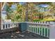 The backyard view shows a deck area with a small fence at 703 S Depew St, Lakewood, CO 80226