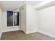 Small basement bedroom with carpet, one egress window, and standard closet at 703 S Depew St, Lakewood, CO 80226