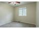 Bedroom featuring neutral walls, carpet, window, and a ceiling fan at 703 S Depew St, Lakewood, CO 80226