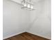 Bright empty room with hardwood floors and modern lighting at 703 S Depew St, Lakewood, CO 80226